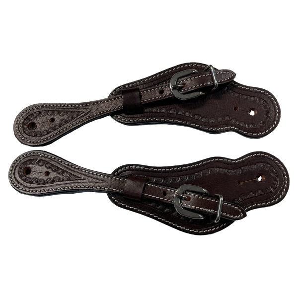 Pair of brown leather spurs on a white background