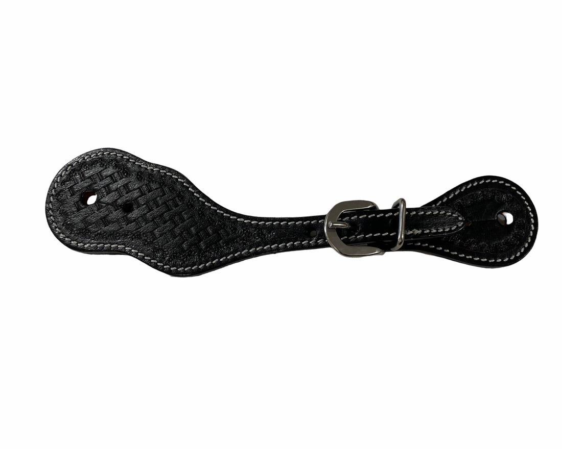 Black leather spur straps with basketweave tooled design on a white background