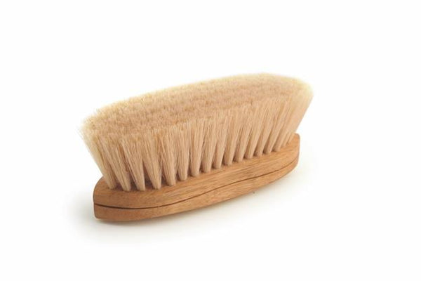 Wooden brush with bristles on a white background
